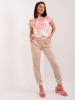 Hurt Beżowo-koralowy komplet welurowy z nadrukiem RUE PARIS