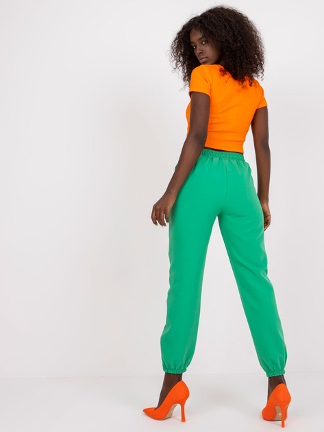 Zielone damskie spodnie z materiału w kant