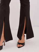 Großhandel Schwarze gestreifte Leggings mit Schlitzen.