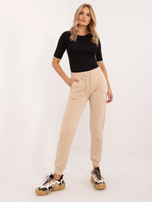 Hurtownia Beżowe ocieplane spodnie dresowe z kieszeniami