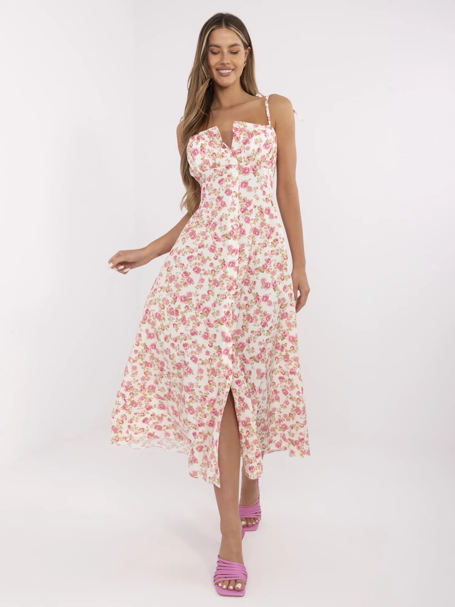 Ecru flared dress with flowers.