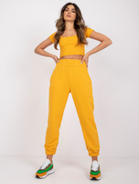 Jasnopomarańczowe spodnie dresowe z kieszeniami RUE PARIS 