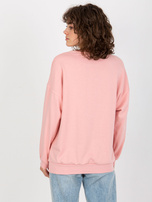 Hurtownia Jasnoróżowa luźna bluza bez kaptura z napisem