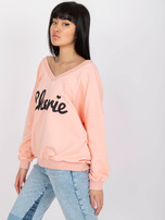 Jasnoróżowa bluza o fasonie oversize z nadrukiem 