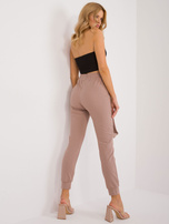 Hurt Ciemnobeżowe spodnie dresowe z ozdobnymi szelkami