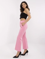 Różowe damskie spodnie z odpinanymi broszkami