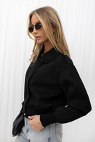 Black transitional jacket with elastic cuffs.