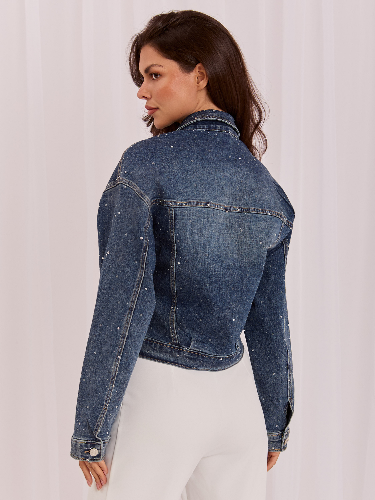Dark blue denim jacket with decorative studs.