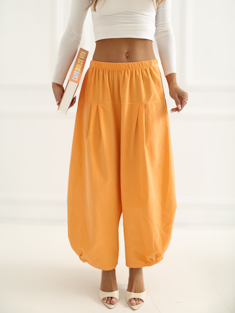 Jasnopomarańczowe sztruksowe spodnie z nogawką 7/8