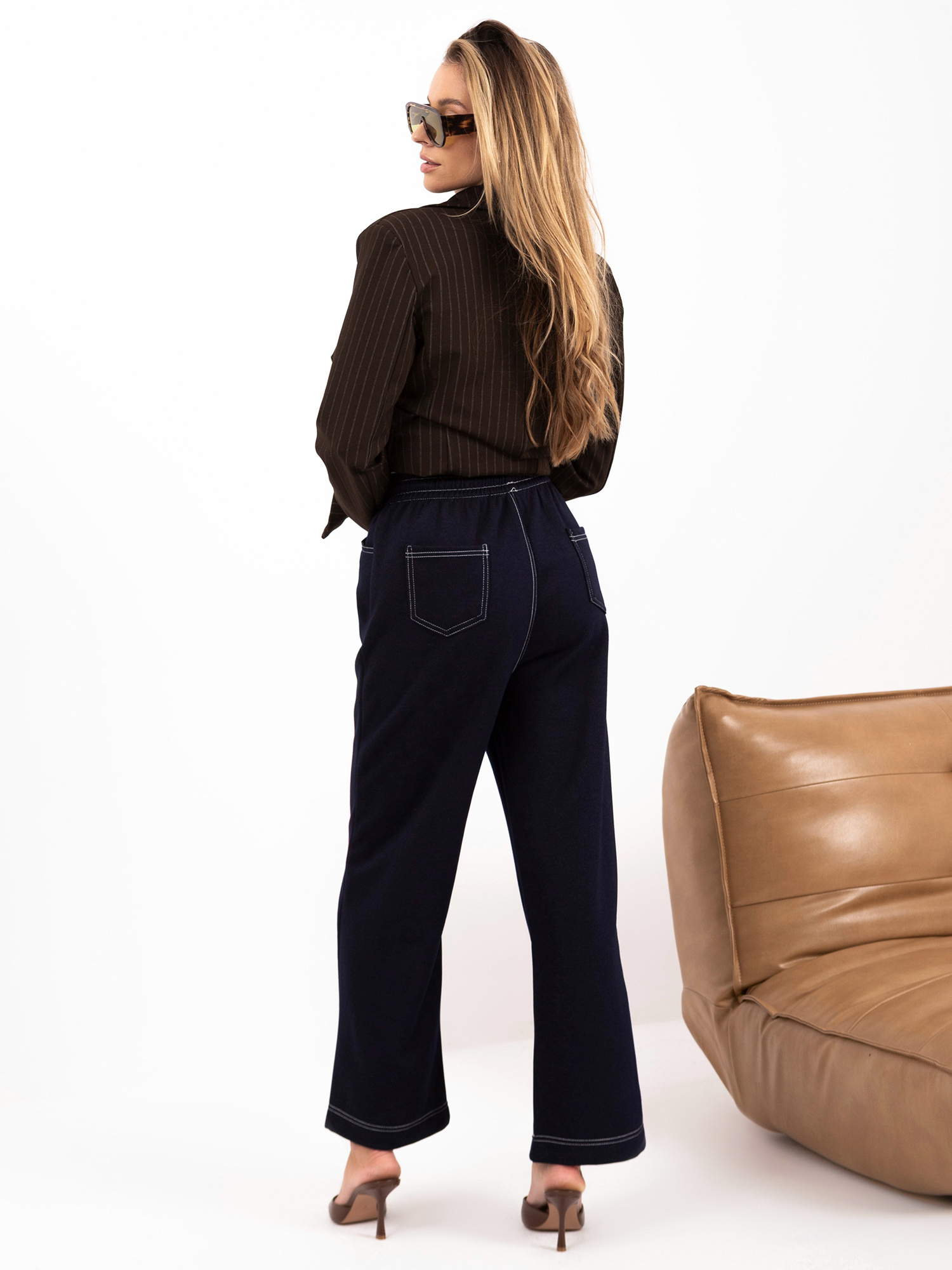 Navy knit pants resembling jeans.