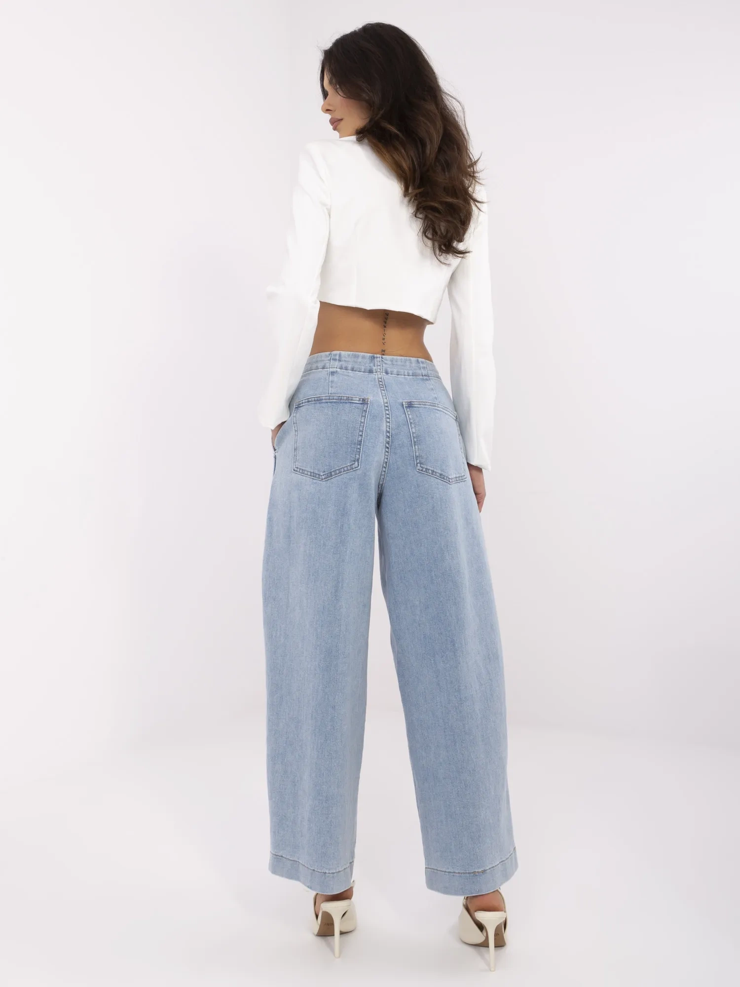 Blue women's baggy jeans with pockets.