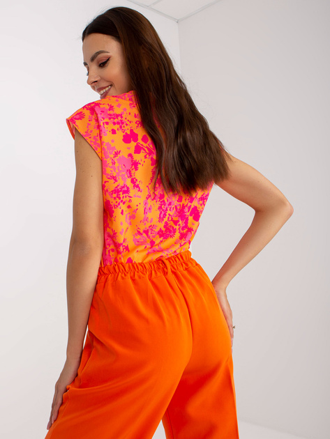 Pomarańczowe spodnie z materiału z szeroką nogawką