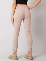 Jasnobeżowe spodnie dresowe z kieszeniami Shadia