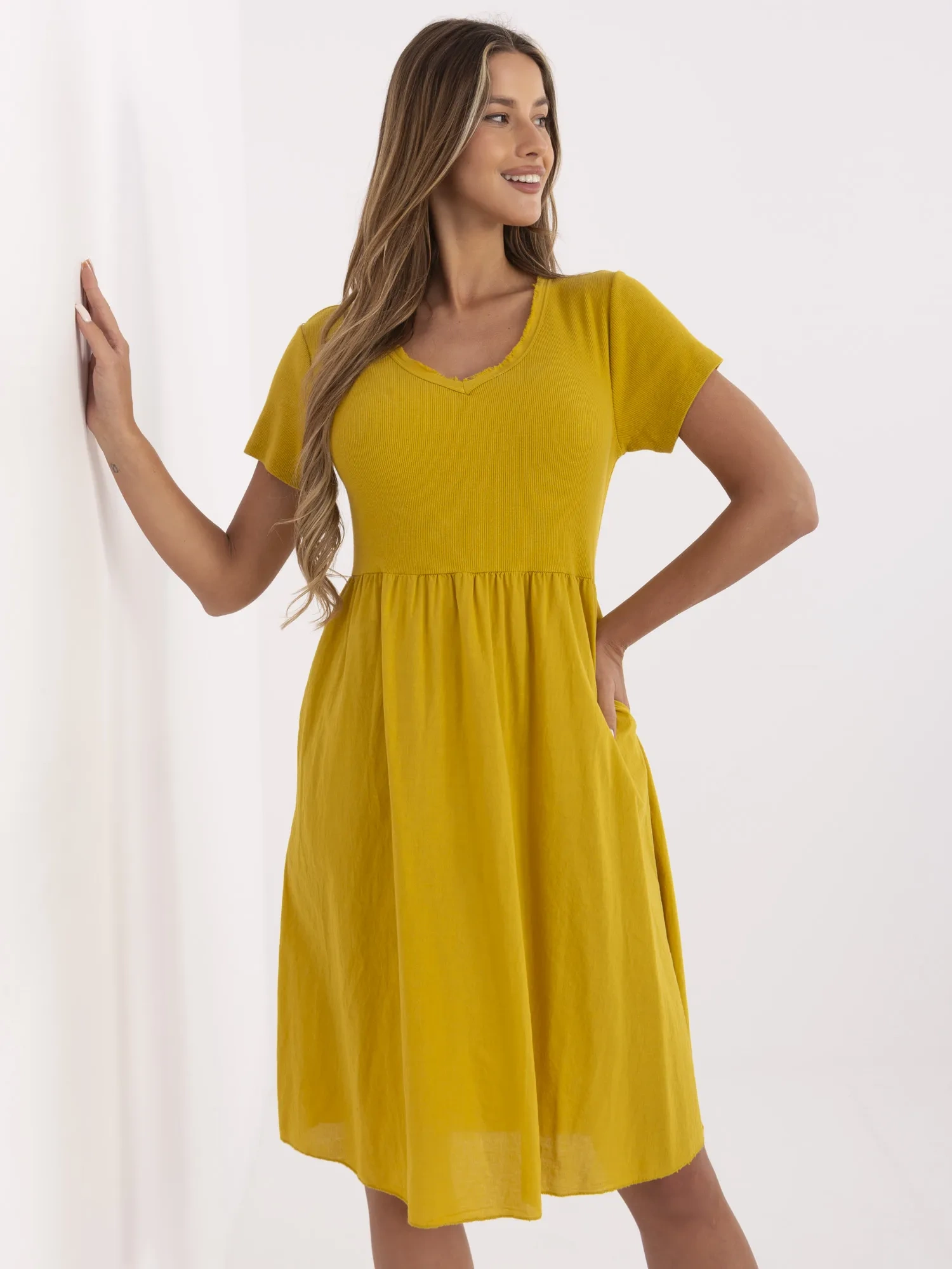 Mustard summer dress with a ribbed top.