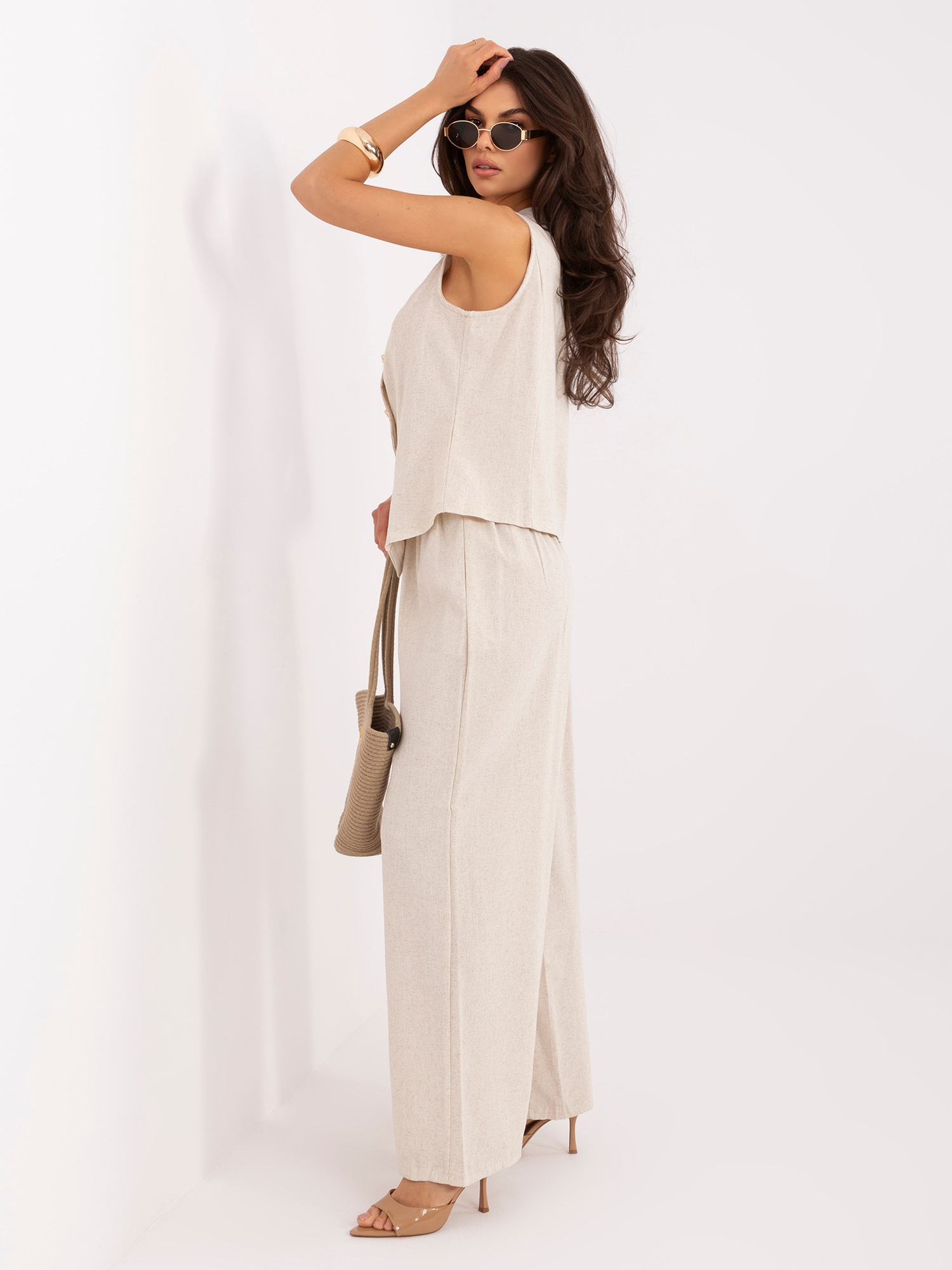 Light beige elegant set with wide trousers.