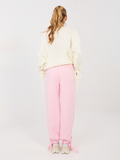 Jasnoróżowe dresowe spodnie wiązane w kostce