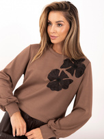 Brown elegant blouse with floral appliqué.