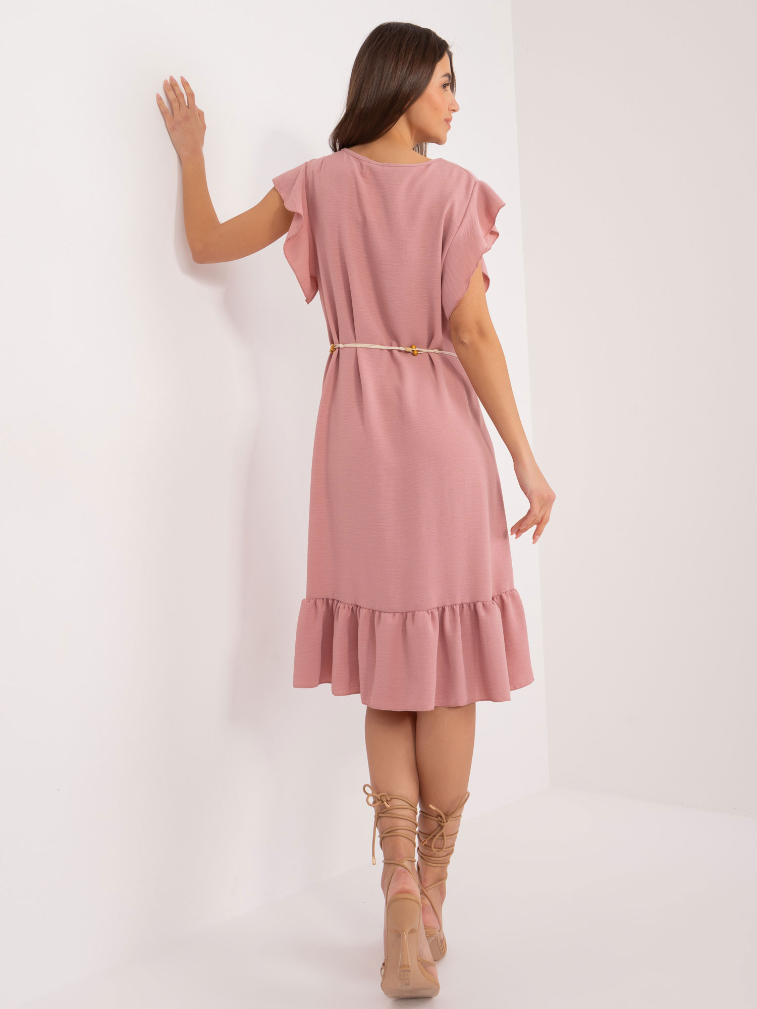 Hurt light beige dress with frill and belt.