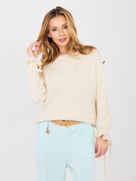 Pastelowy sweter z wiązaniami przy rękawach