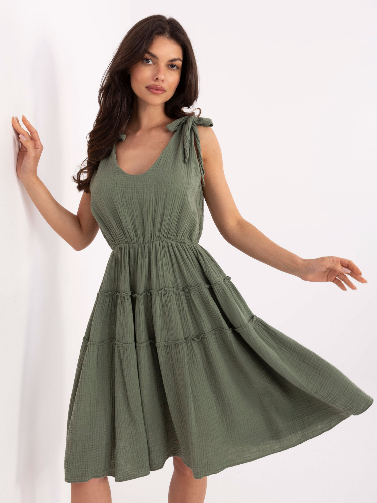 Khaki flared dress made of muslin.