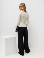Light beige elegant wrap sweater.