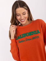 Hurt Ciemnopomarańczowa luźna bluza bez kaptura z napisami 