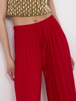 Red wide pleated pants.