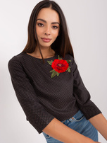 Schwarz kurze Bluse mit 3/4-Ärmeln.