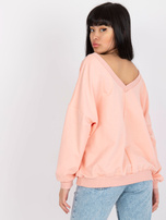 Jasnoróżowa bluza o fasonie oversize z nadrukiem 