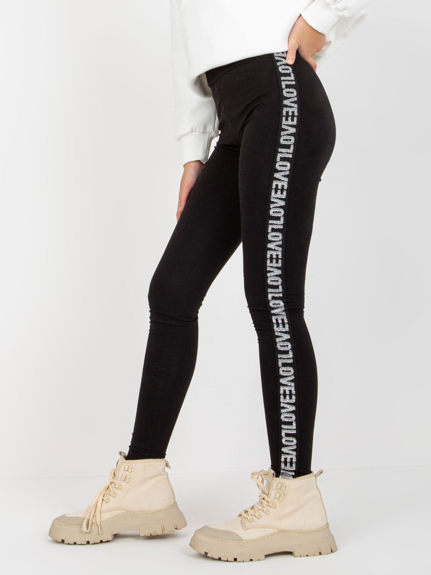 Czarne damskie legginsy casualowe z lampasami