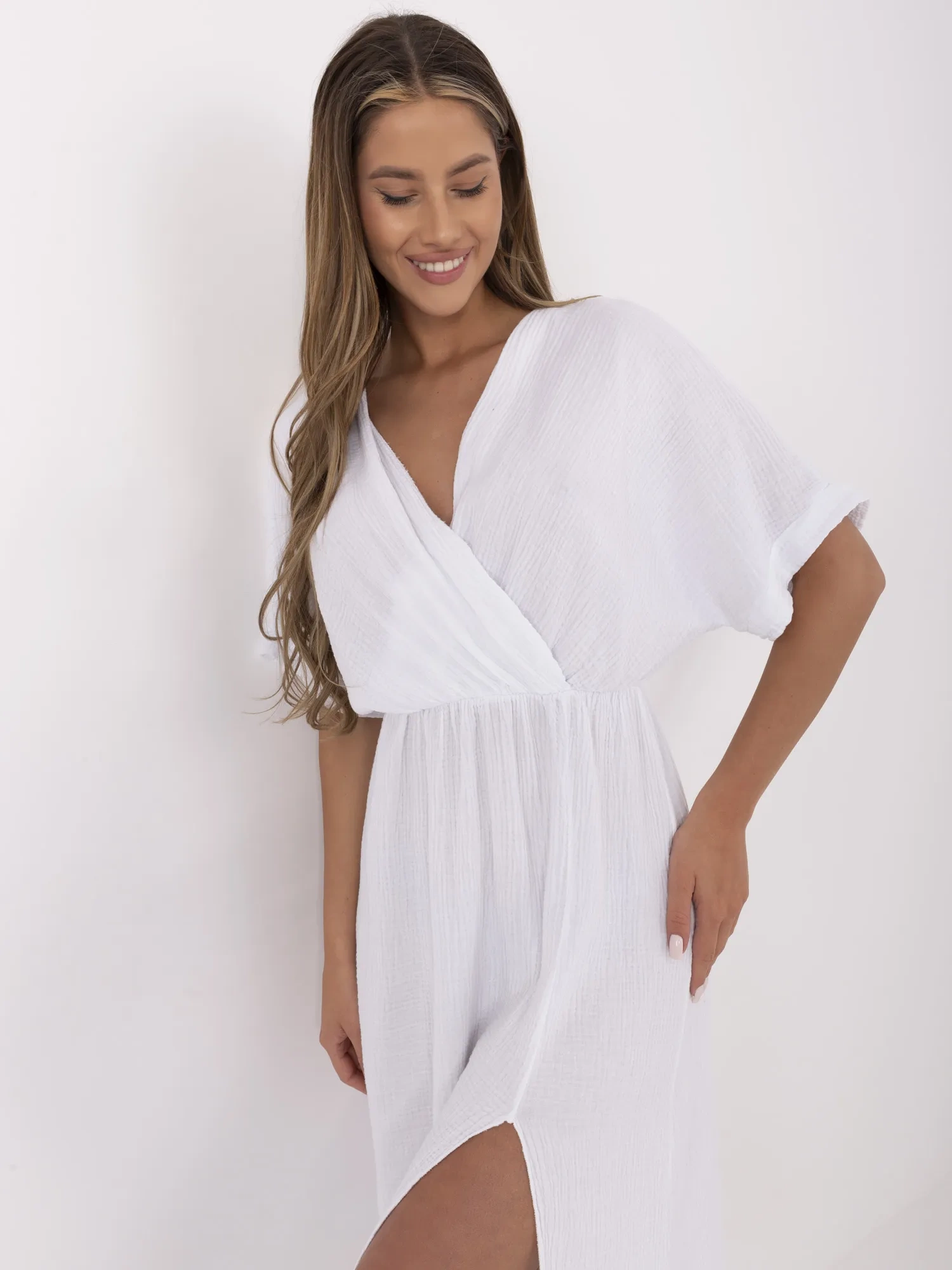 White muslin dress with short sleeves.