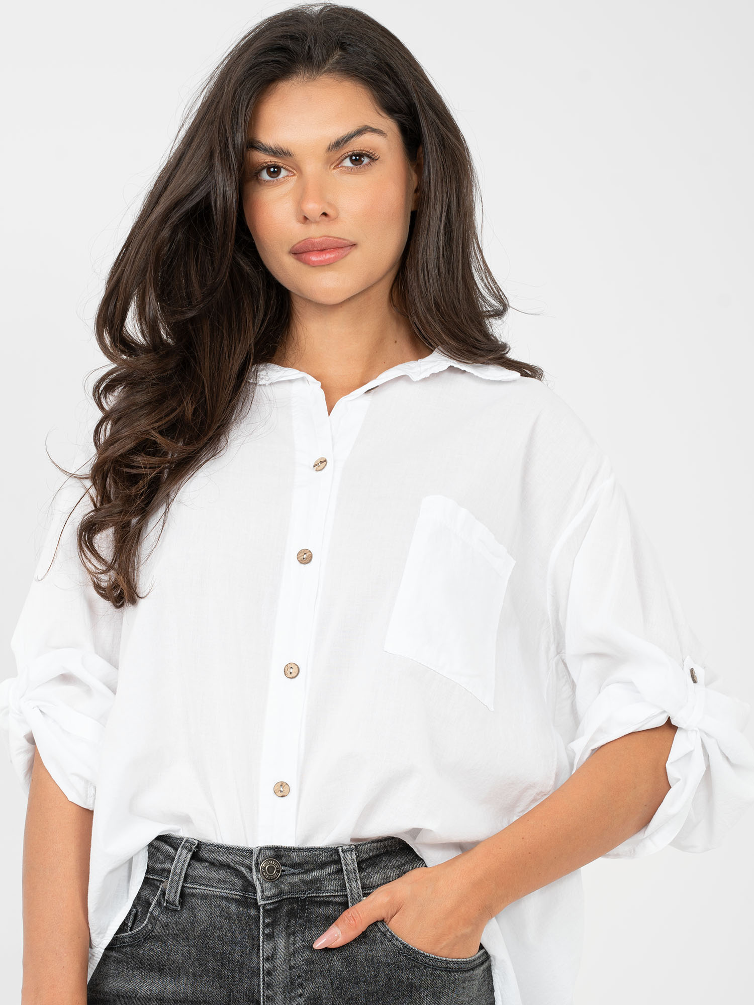 White women's shirt with a longer back.