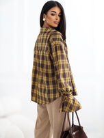 Yellow checkered shirt with decorative ties at the cuffs.