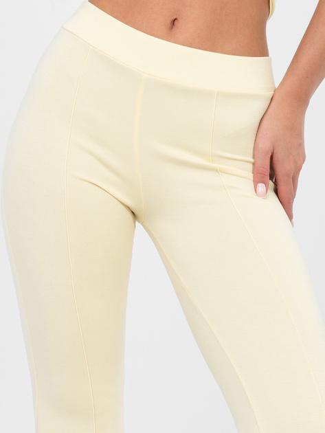 Pastelowe żółte dresowe spodnie typu dzwony RUE PARIS