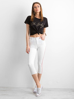 White pants with red stripe