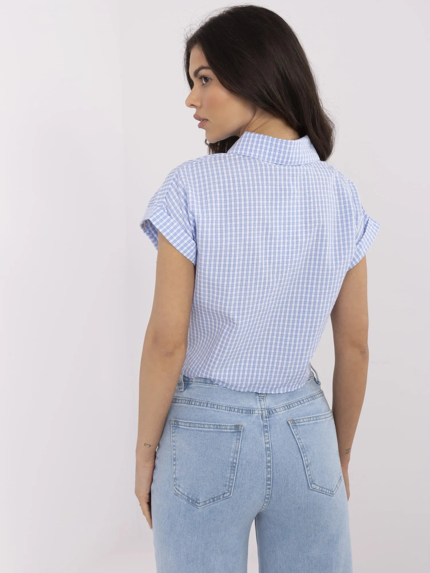 Blue and white short-sleeved button-up shirt.
