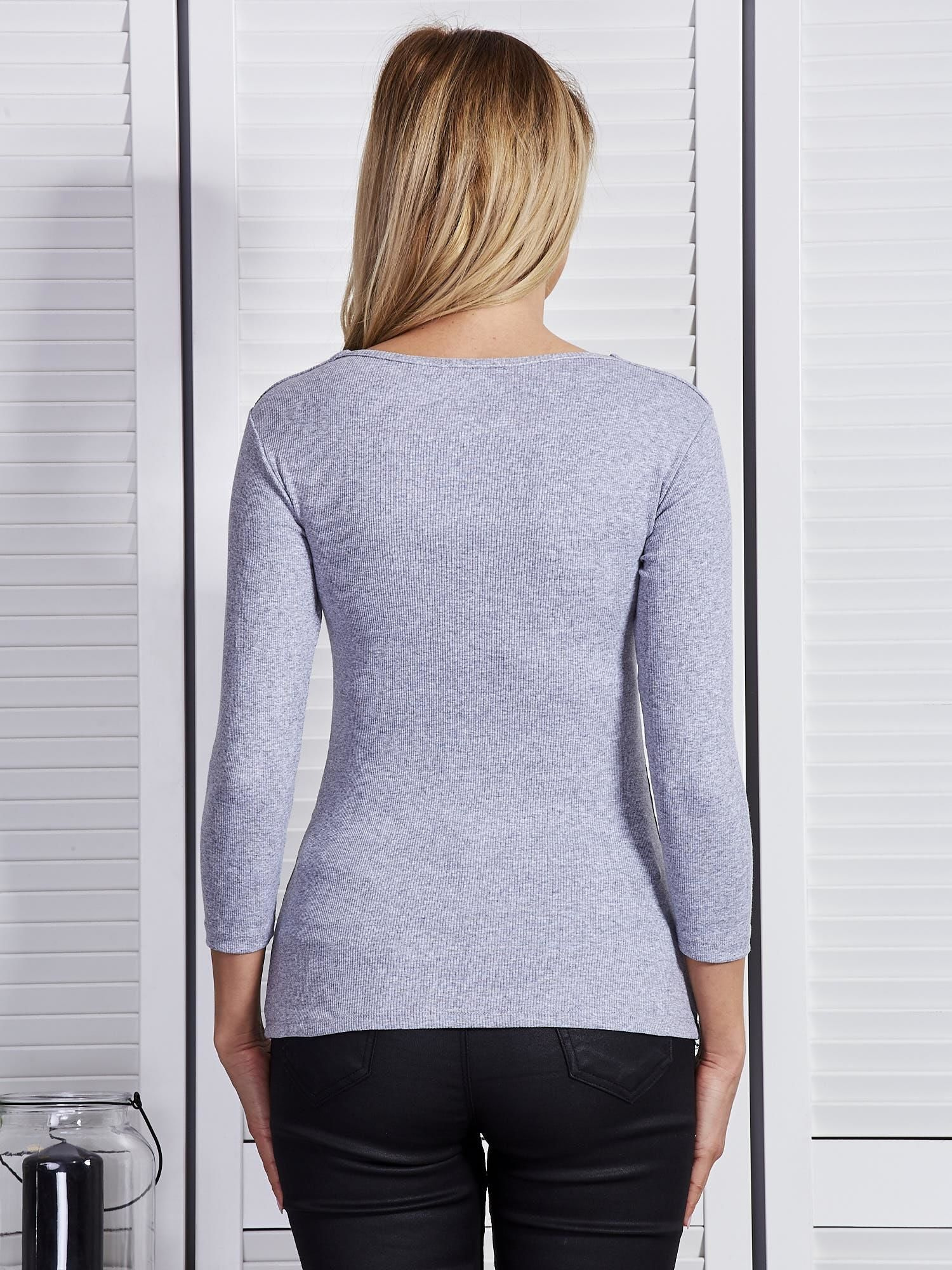 Light gray blouse with lace-up neckline