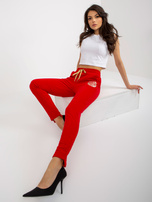 Hurtownia Czerwone damskie spodnie dresowe z nadrukiem