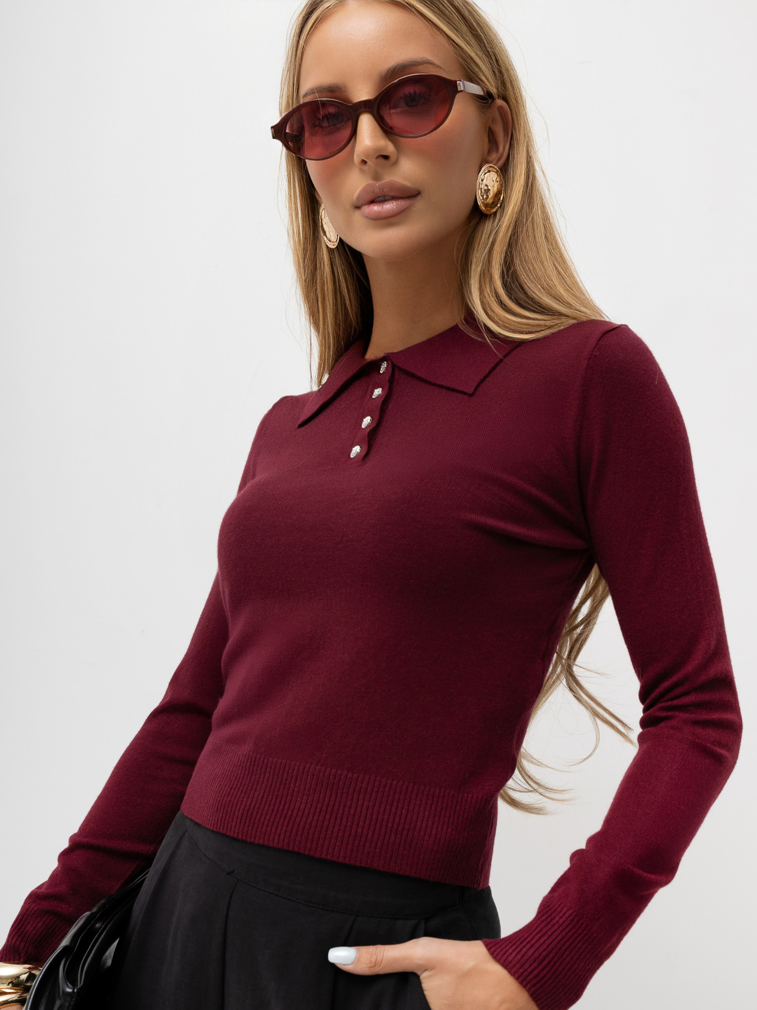 Burgundy women's polo sweater with ribbed cuffs.
