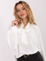 White shirt blouse with a tie.
