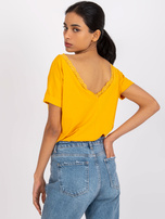 Jasnopomarańczowa bluzka z dekoltem na plecach Salma RUE PARIS