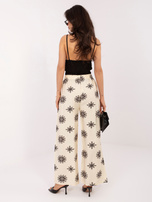 Jasnobeżowo-czarne damskie spodnie palazzo na lato