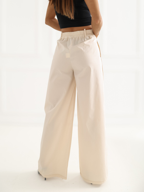 Jasnobeżowe damskie spodnie palazzo z kieszeniami RUE PARIS