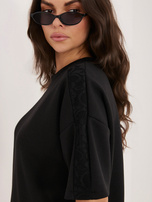 Czarna damska bluzka oversize od kompletu 
