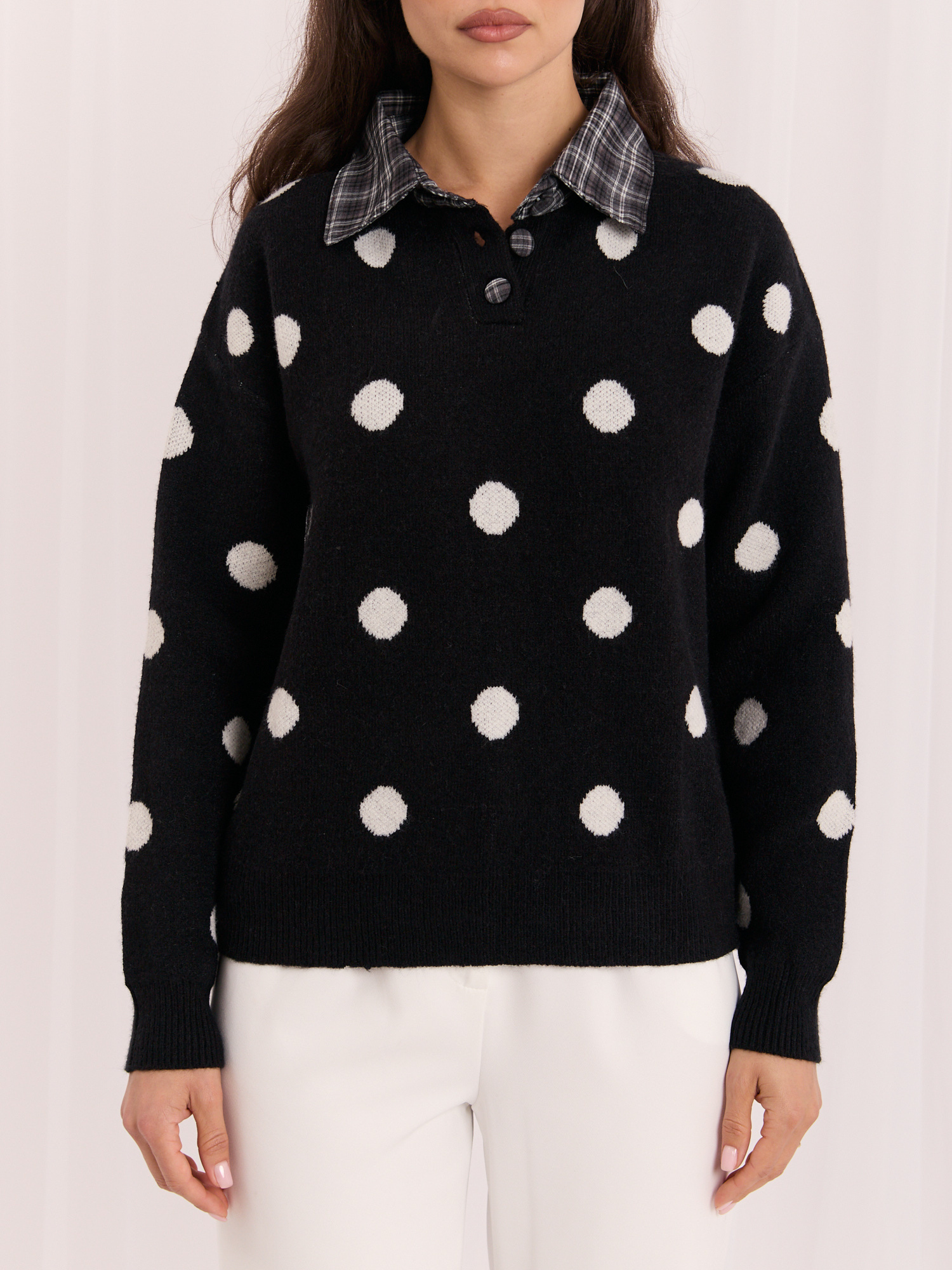 Black women's oversized polka dot sweater.