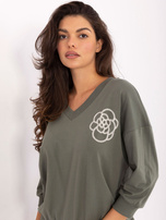 Khaki cotton blouse with a V-neck.