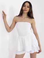 White muslin jumpsuit in a dress style.
