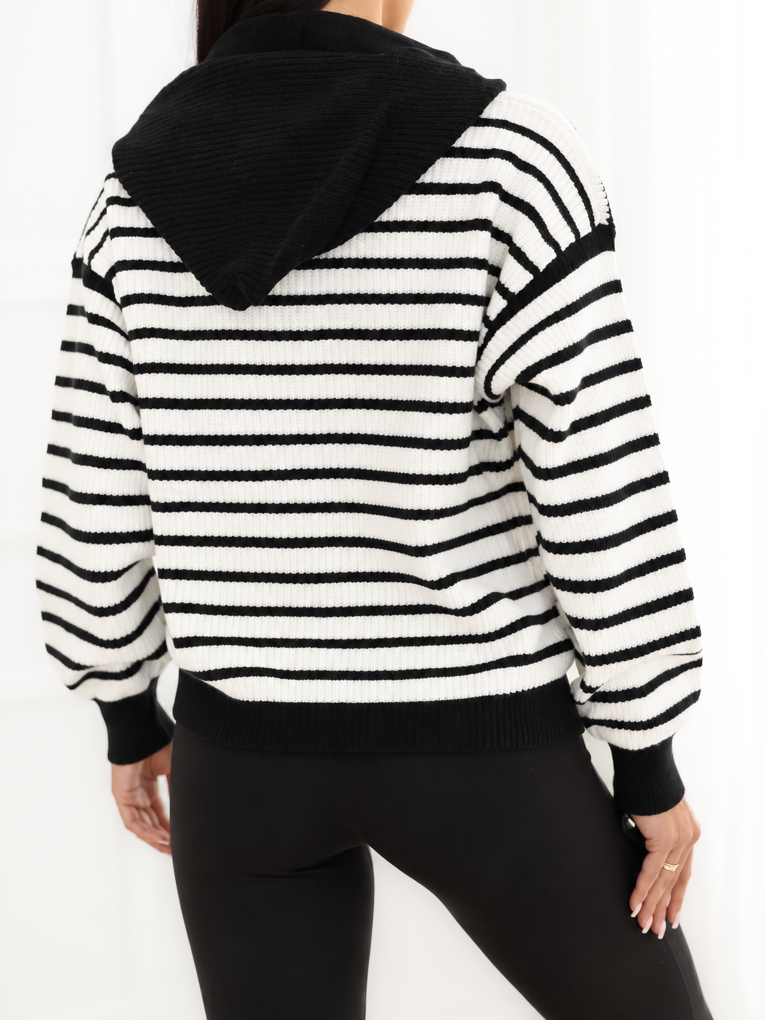 Black striped cardigan with colorful hearts.