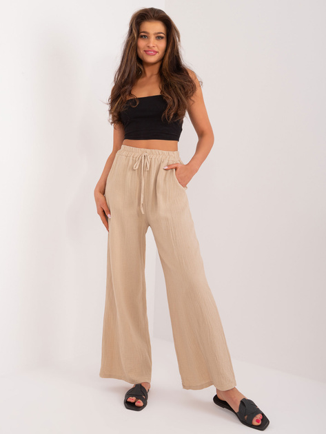 Hurt Beżowe zwiewne spodnie materiałowe z wiązaniem