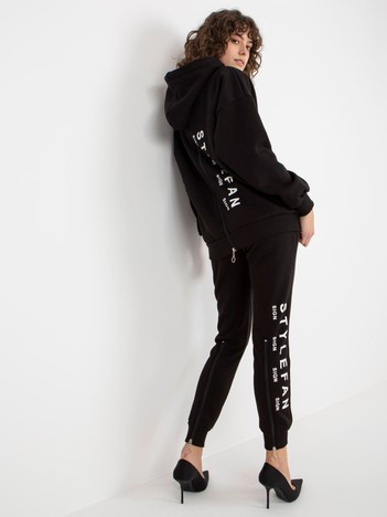 Hurt Black women's tracksuit set with inscriptions and zippers.